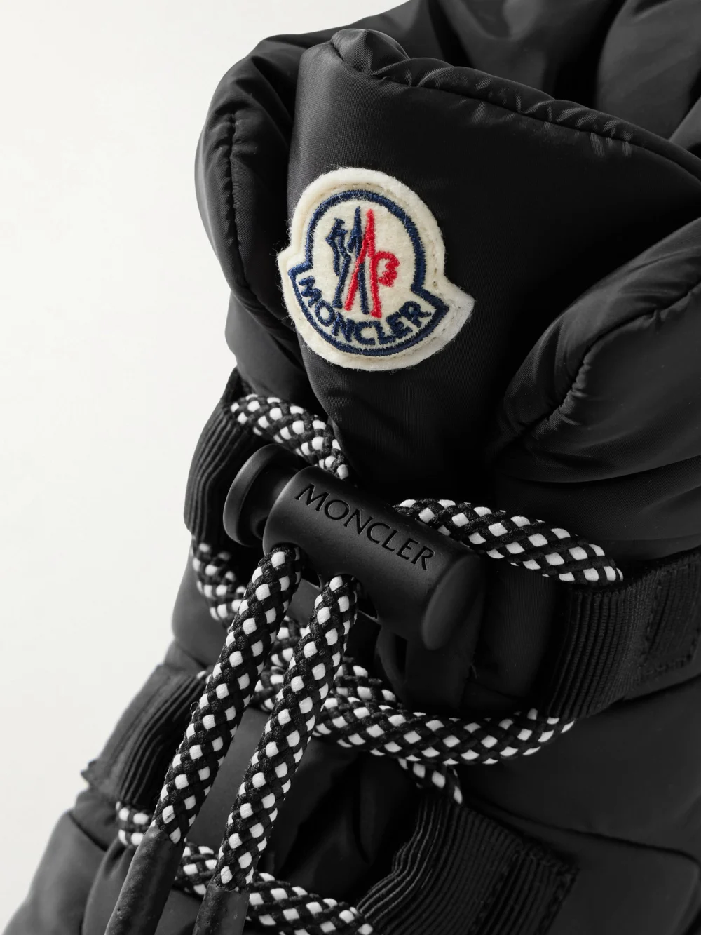 Close-up detail of the Moncler Gaia Quilted Shell Ankle Boots