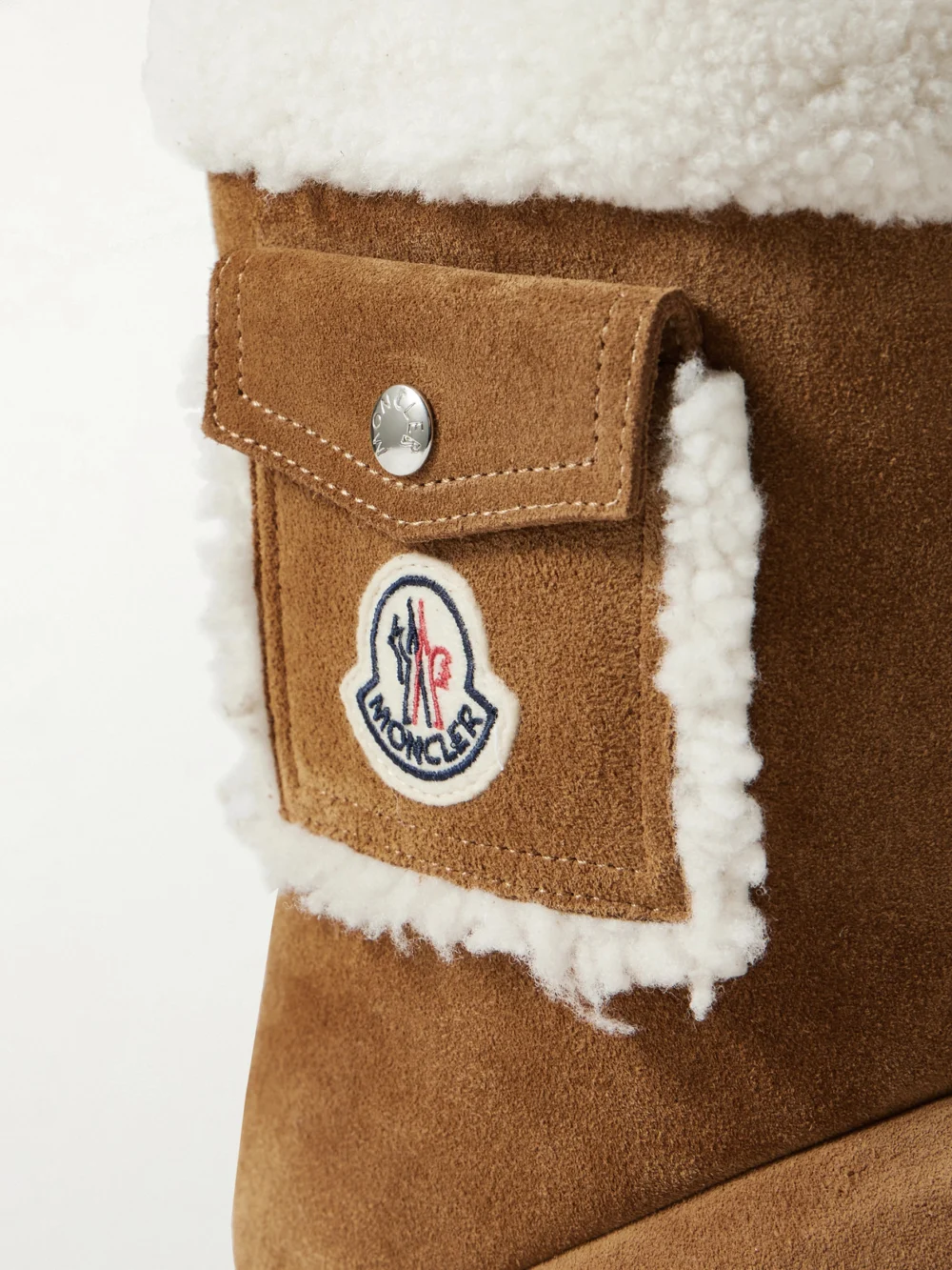 Close-up detail of the Moncler Gaia Shearling-trimmed Quilted Suede Boots