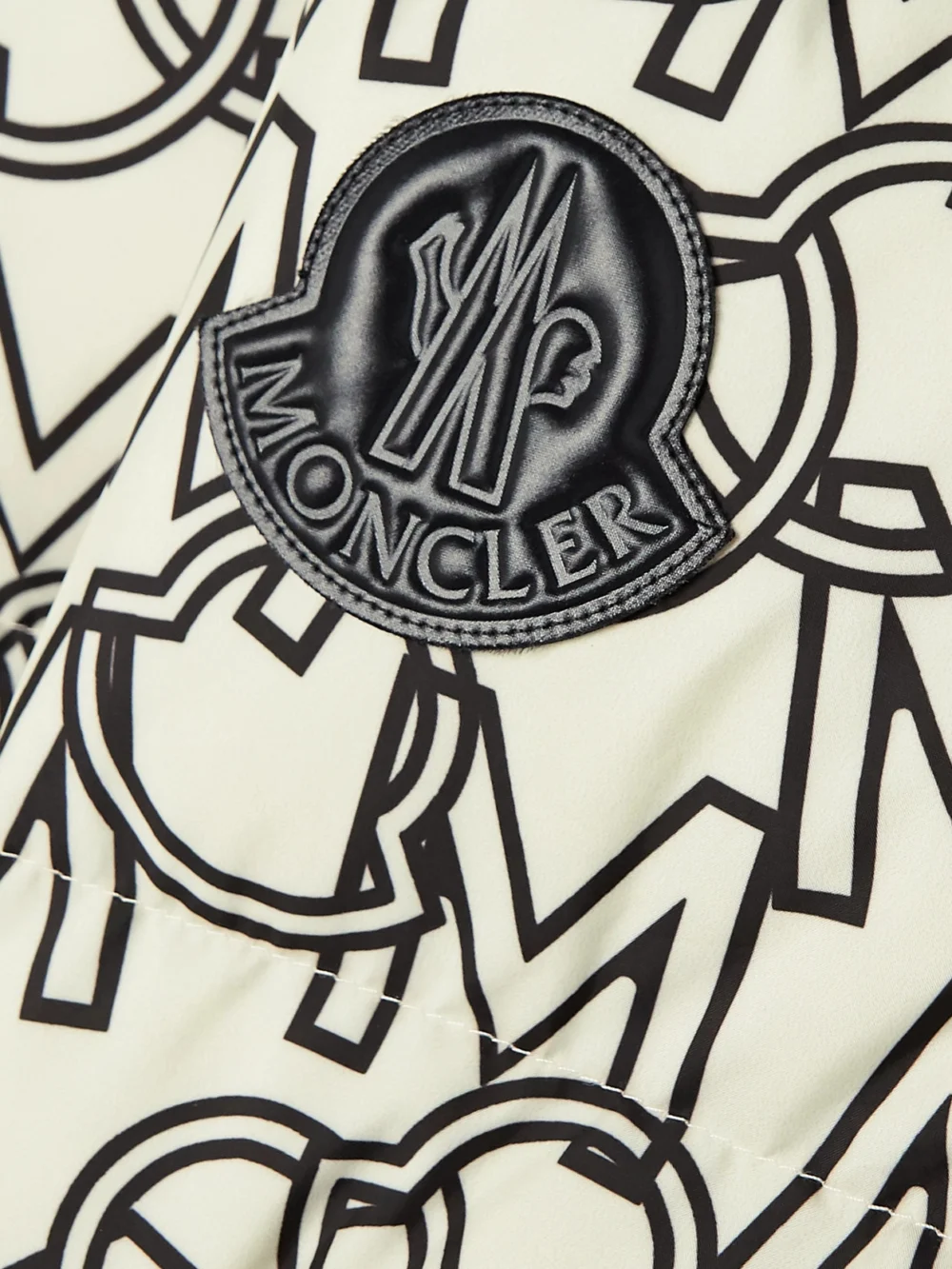 Close-up detail of the Moncler Gaou Hooded Printed Quilted Shell Down Coat