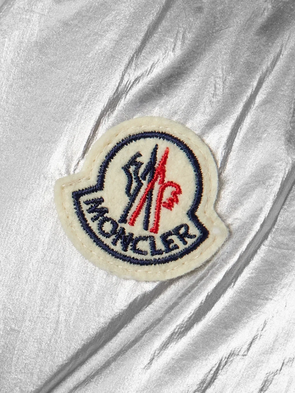 Close-up detail of the Moncler Gaou Hooded Quilted Metallic Shell Down Jacket