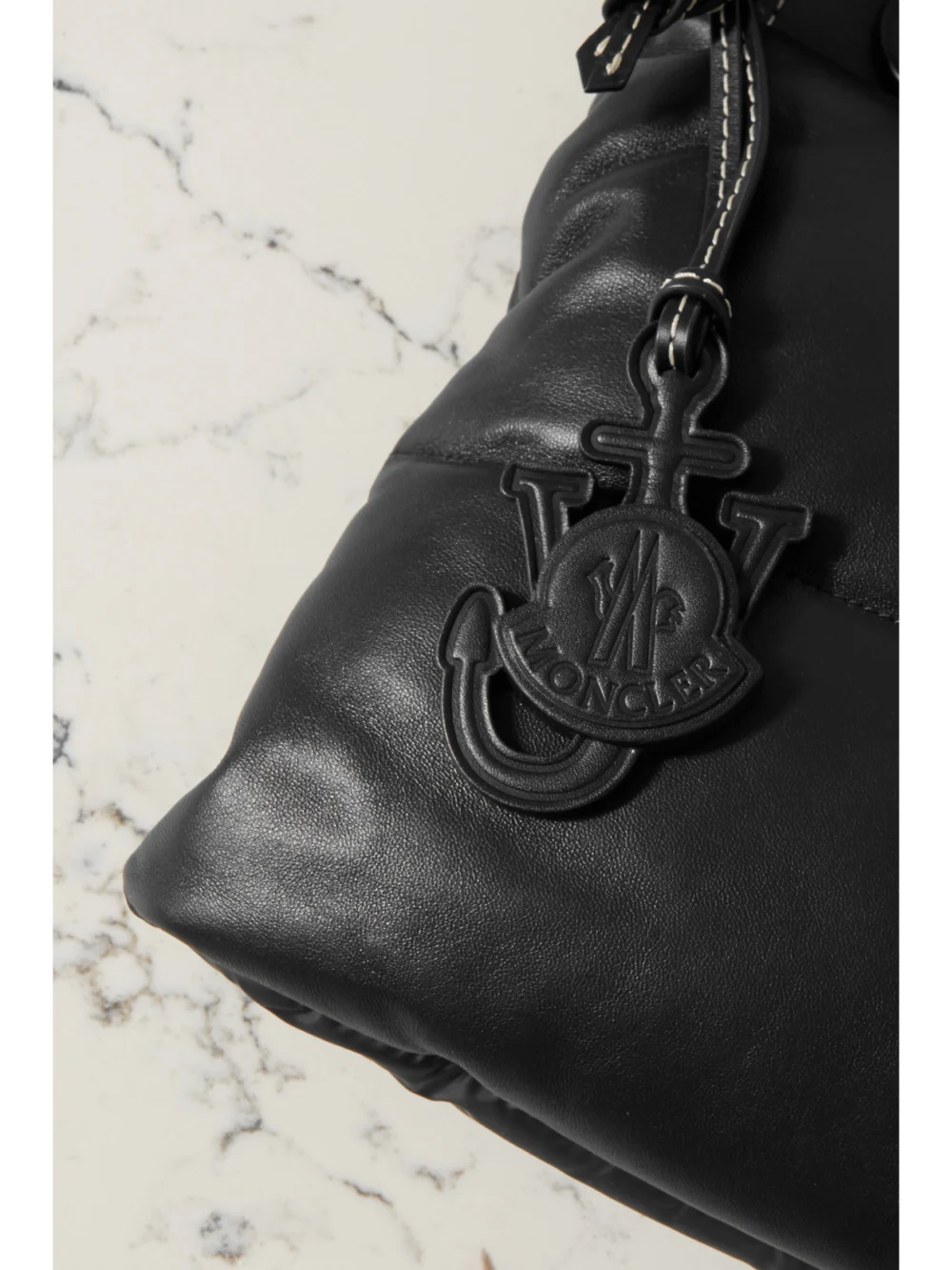 Close-up detail of the Moncler Genius + 1 Jw Anderson Quilted Padded Shell and Leather Tote