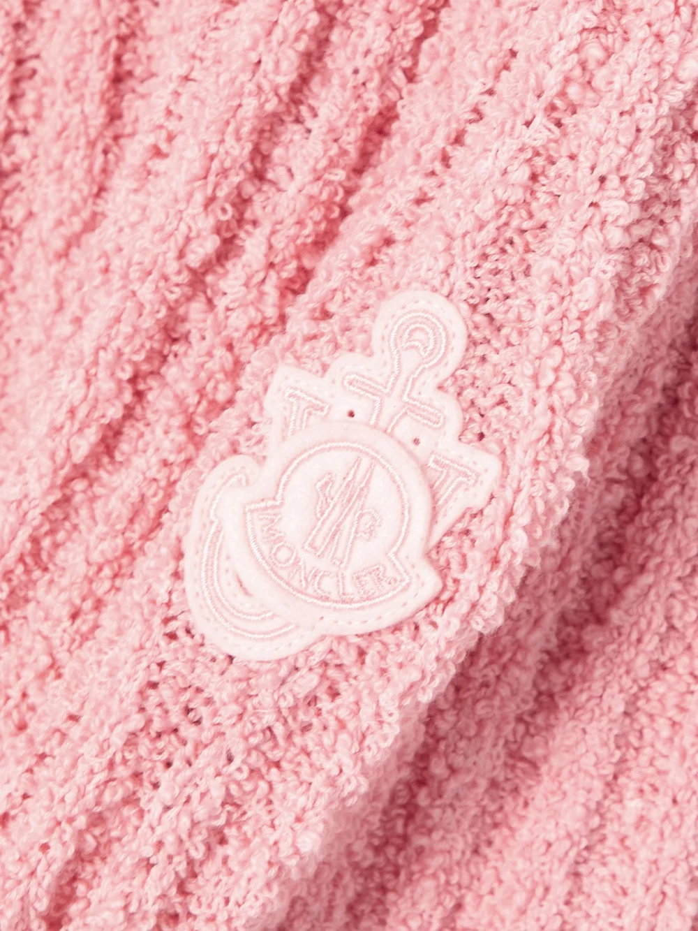 Close-up detail of the Moncler Genius + Jw Anderson Appliquéd Ribbed Cotton-blend Bouclé Sweater