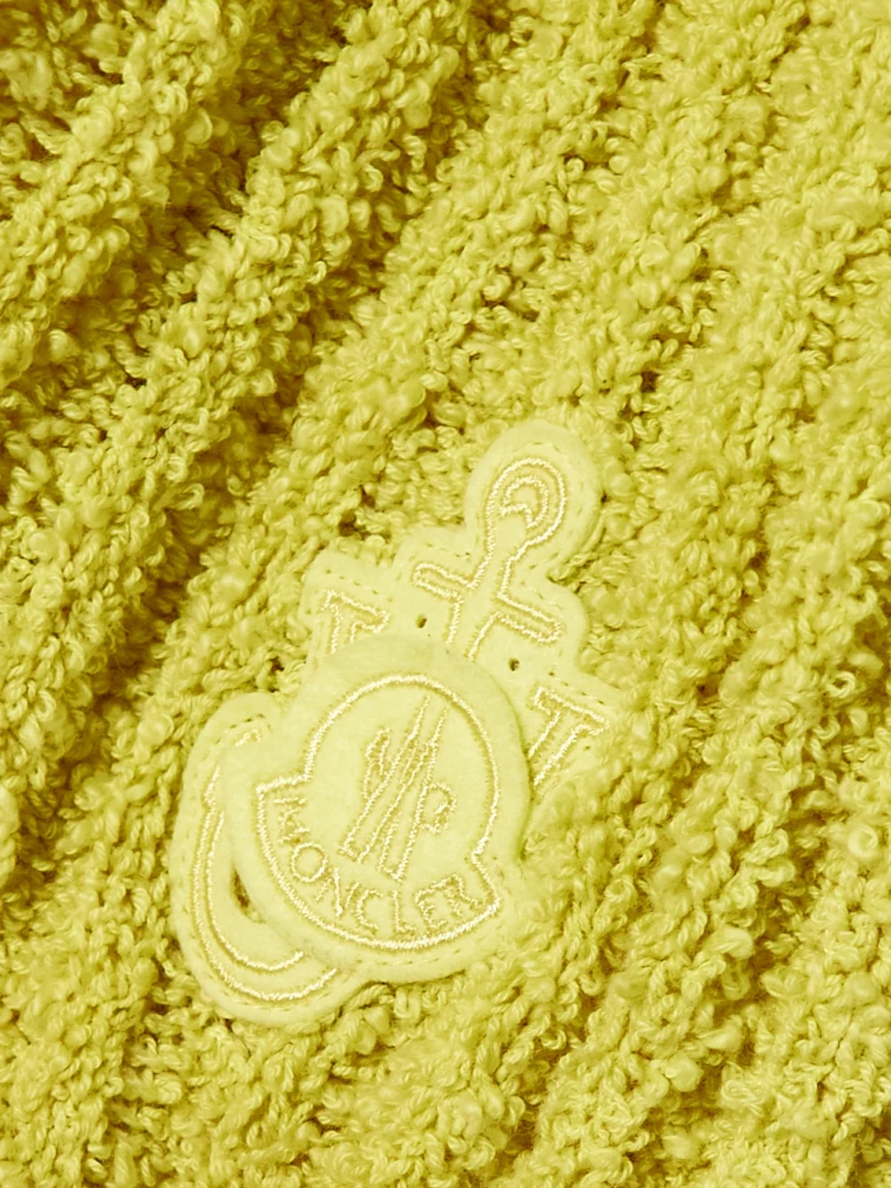 Close-up detail of the Moncler Genius + Jw Anderson Appliquéd Ribbed Cotton-blend Bouclé Sweater