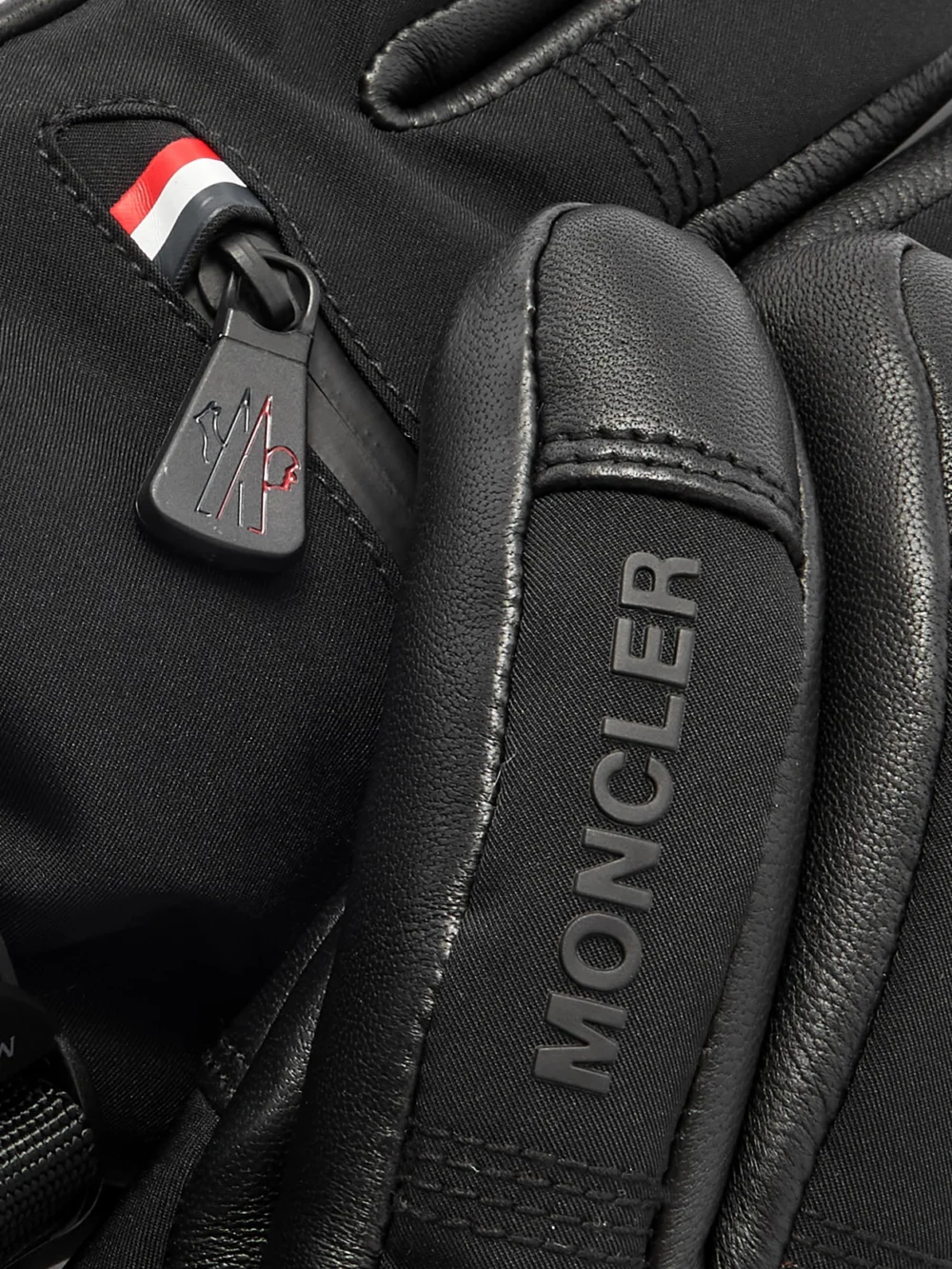 Close-up detail of the Moncler Grenoble Appliquéd Paneled Gore-tex® and Leather Gloves