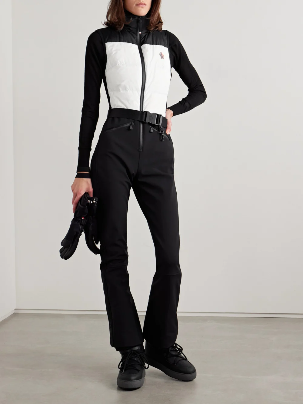 Moncler Grenoble Belted Paneled Quilted Down Ski Suit, worn by a model