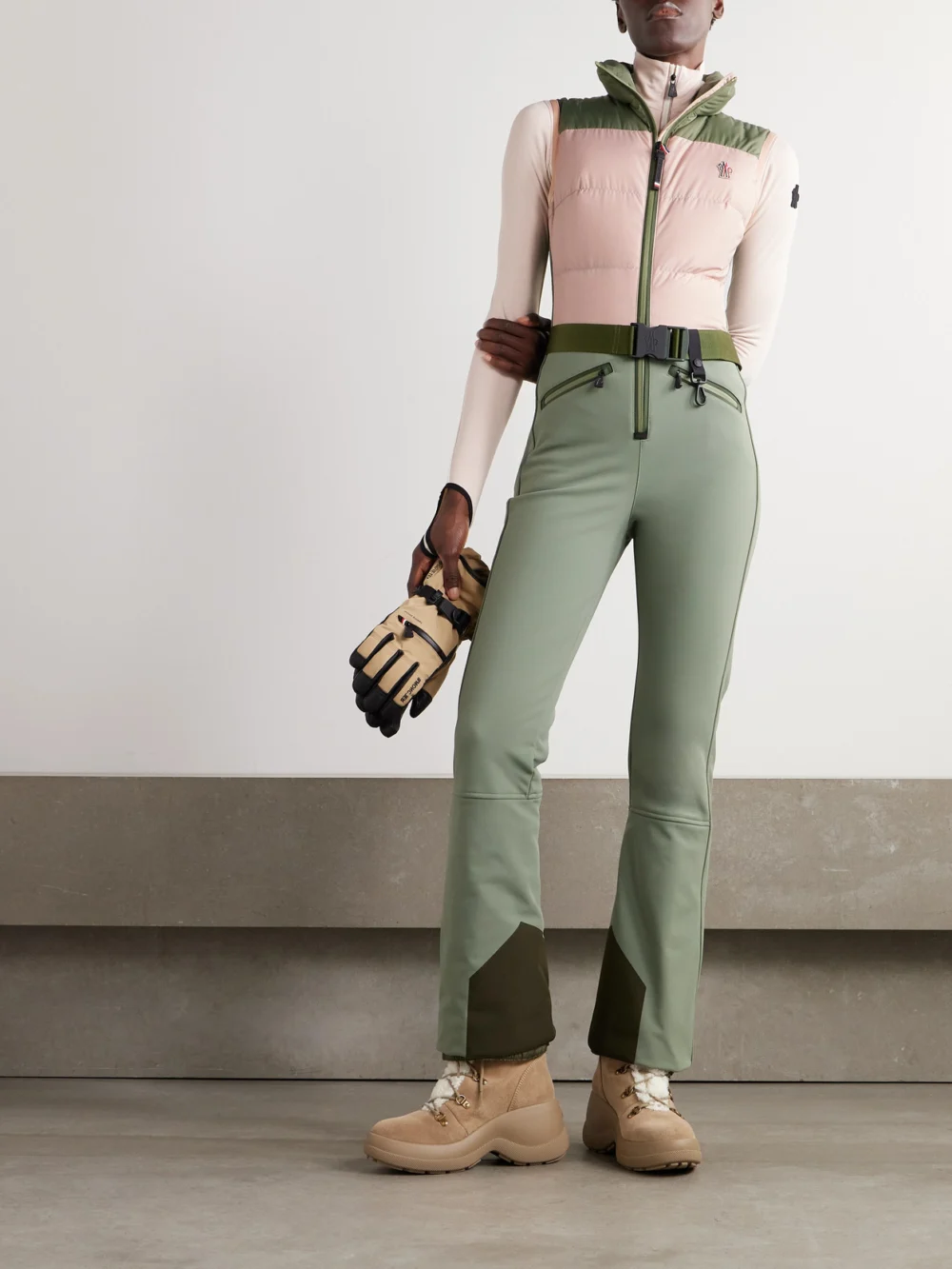 Moncler Grenoble Belted Paneled Quilted Down Ski Suit, worn by a model