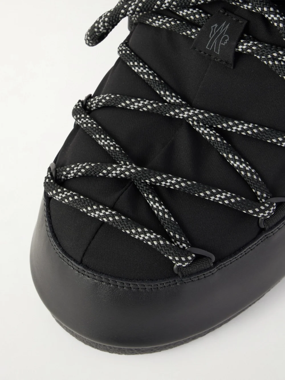 Close-up detail of the Moncler Grenoble + Moon Boot Icon Shell and Leather Snow Boots