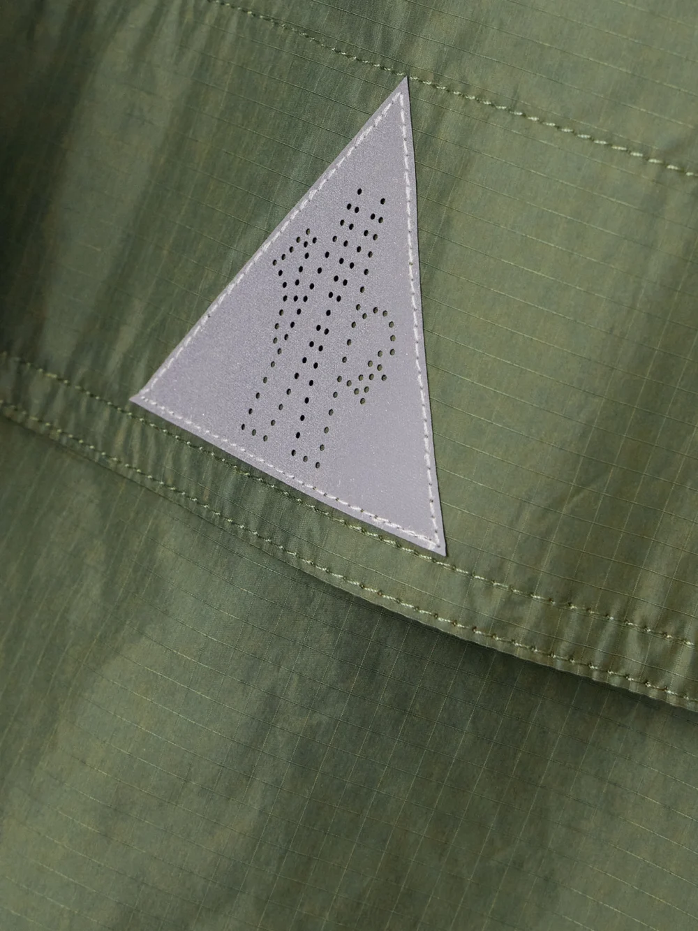 Close-up detail of the Moncler Grenoble Nuvolau Polartec Belted Hooded Ripstop Jacket