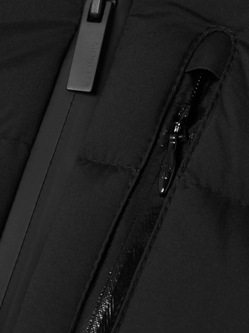 Close-up detail of the Moncler Herbe Hooded Quilted Shell Down Jacket