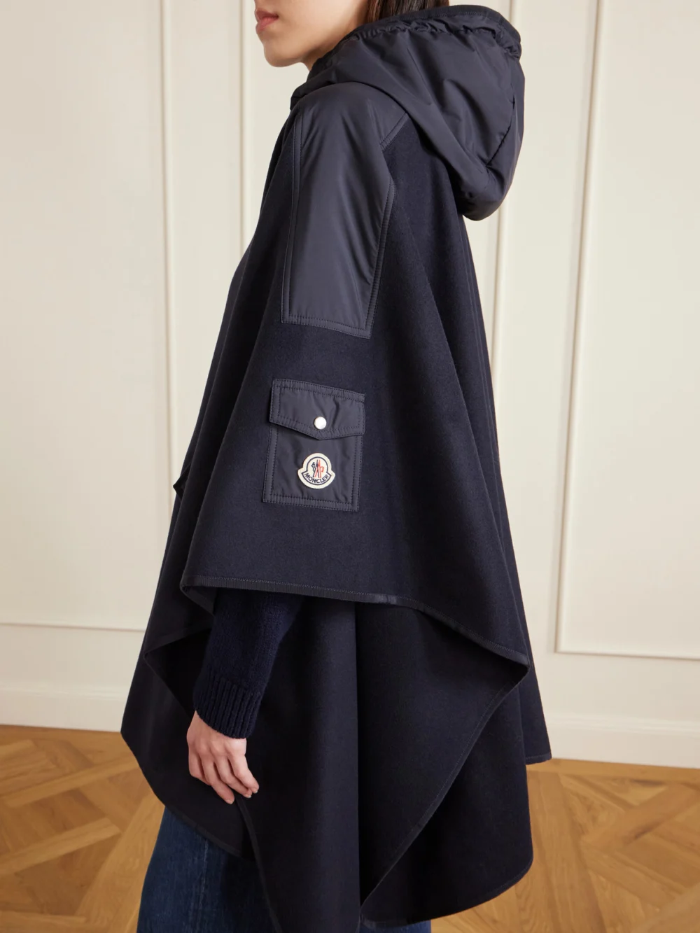 Close-up detail of the Moncler Hooded Appliquéd Shell-trimmed Wool-blend Cape