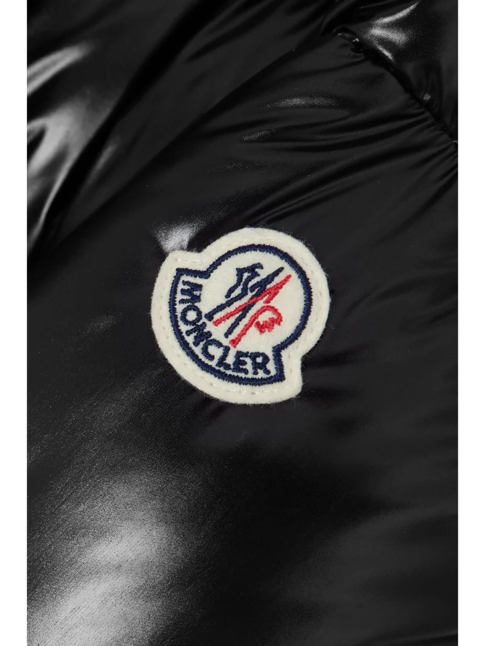 Close-up detail of the Moncler Huppe Appliquéd Quilted Padded Hooded Shell Down Jacket