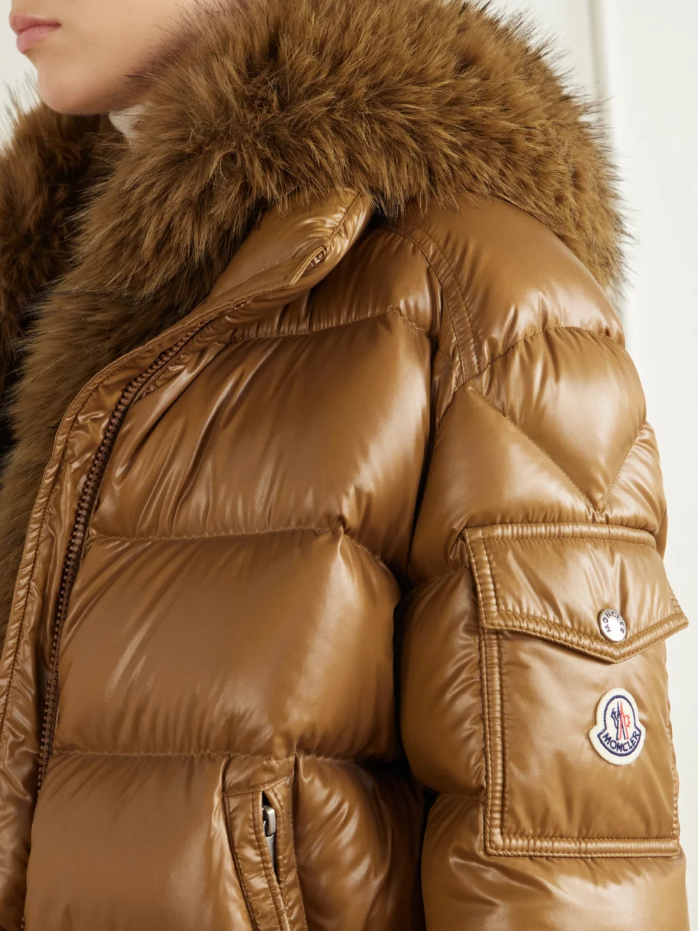 Close-up detail of the Moncler Hypolais Hooded Plush-trimmed Quilted Shell Down Jacket
