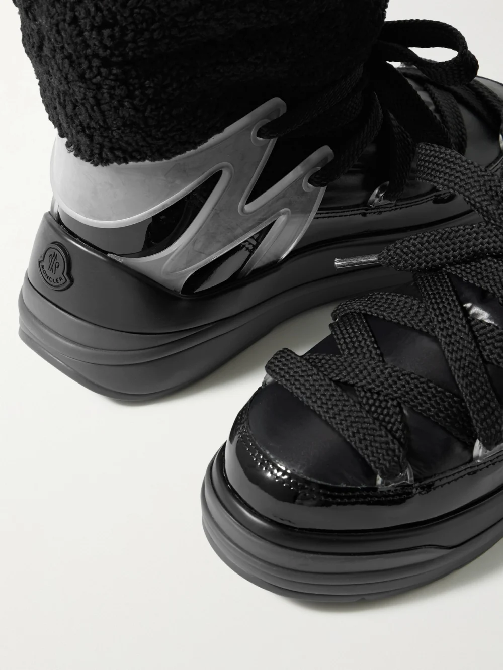 Close-up detail of the Moncler Insolux M Rubber-trimmed Fleece, Shell and Patent-leather Snow Boots
