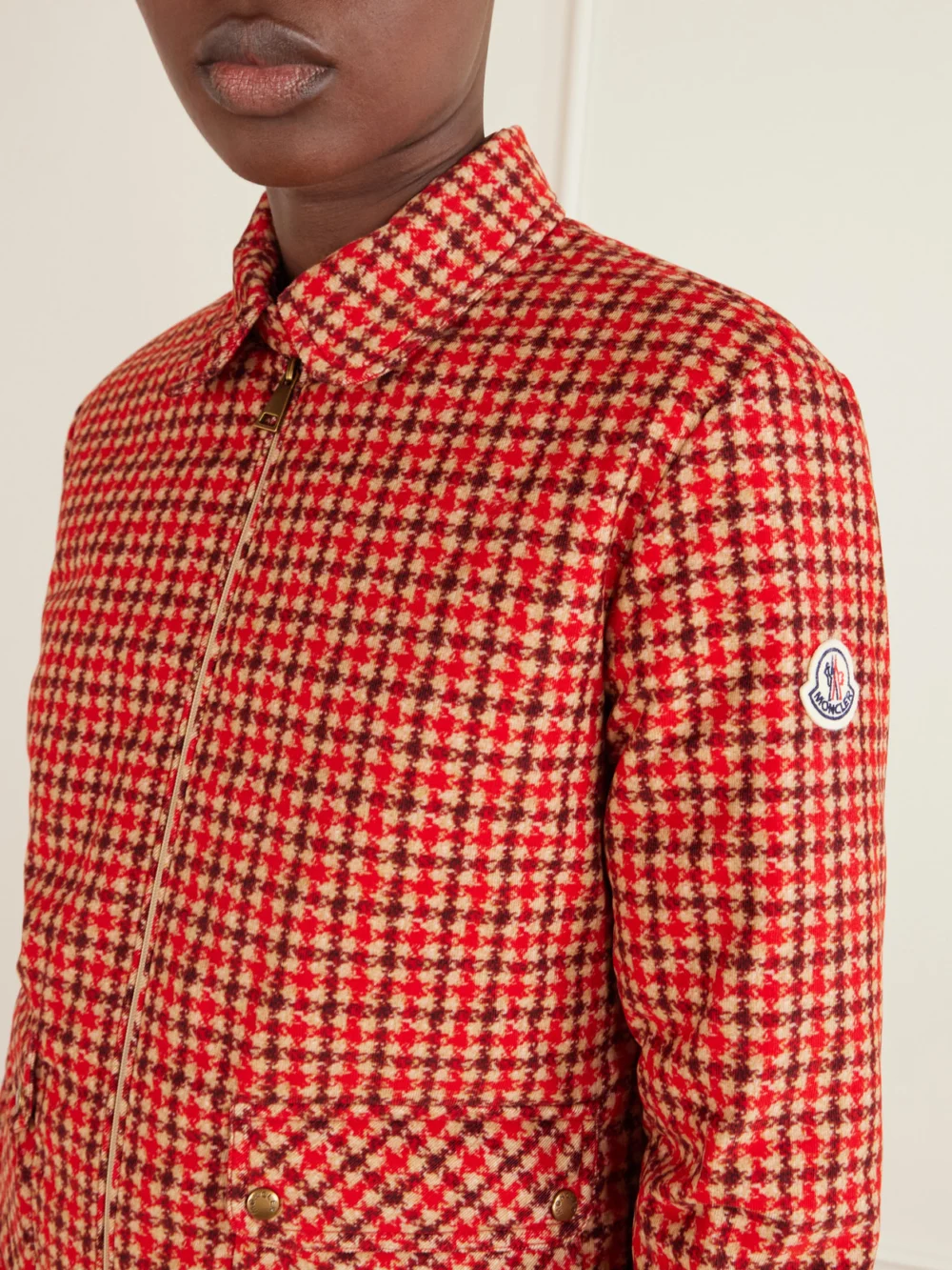 Close-up detail of the Moncler Lanset Logo-appliquéd Checked Cotton Down Jacket