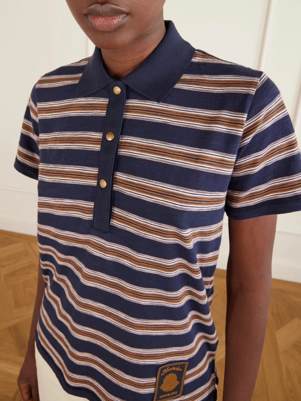 Close-up detail of the Moncler Logo-appliquéd Striped Cotton Polo Shirt