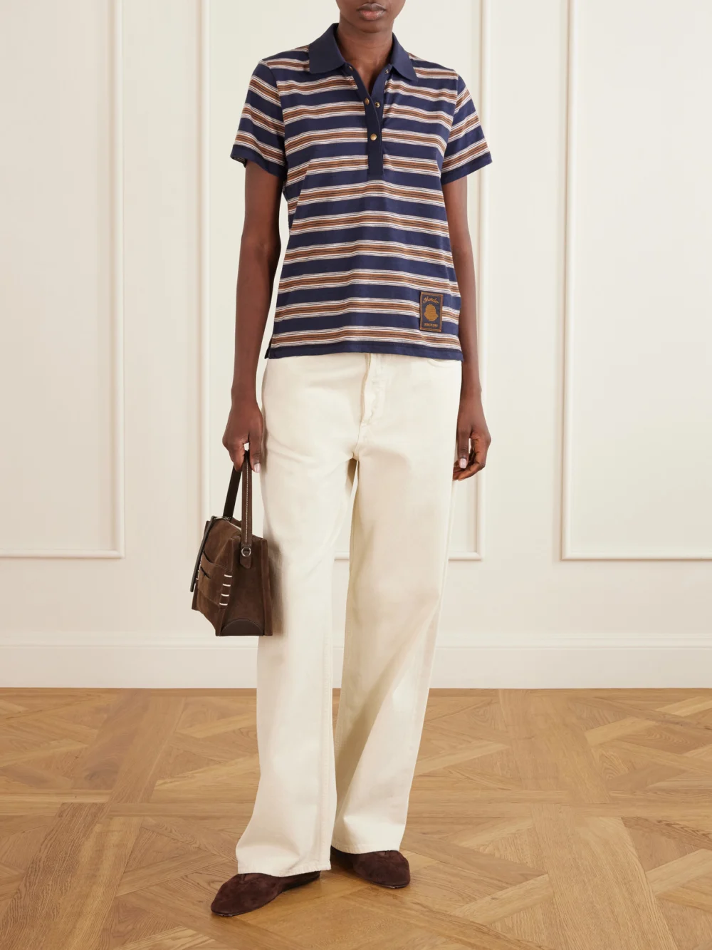 Moncler Logo-appliquéd Striped Cotton Polo Shirt, worn by a model
