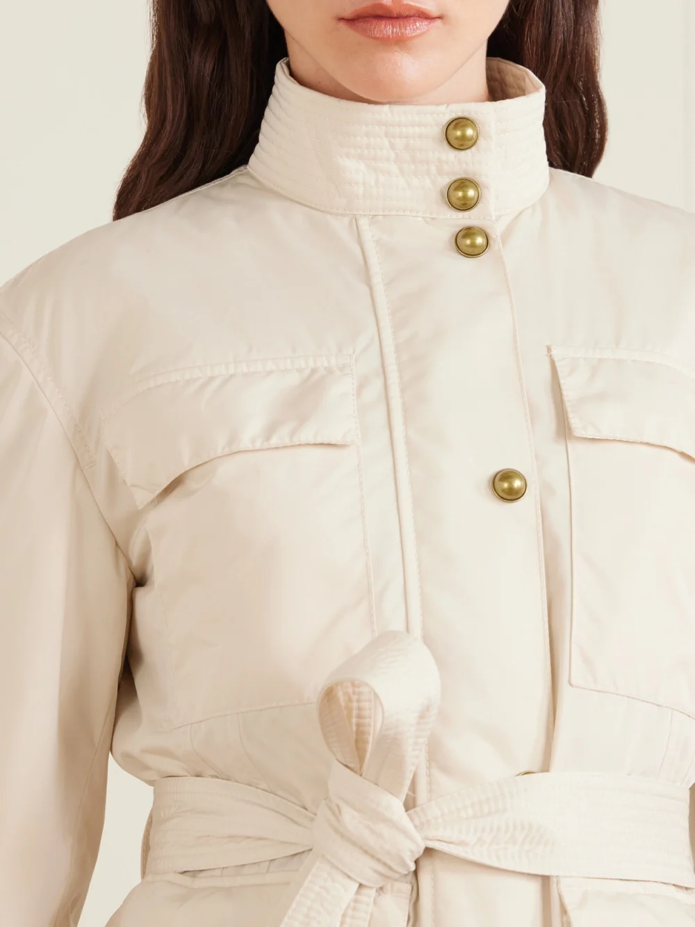 Close-up detail of the Moncler Maitake Appliquéd Belted Gabardine Jacket