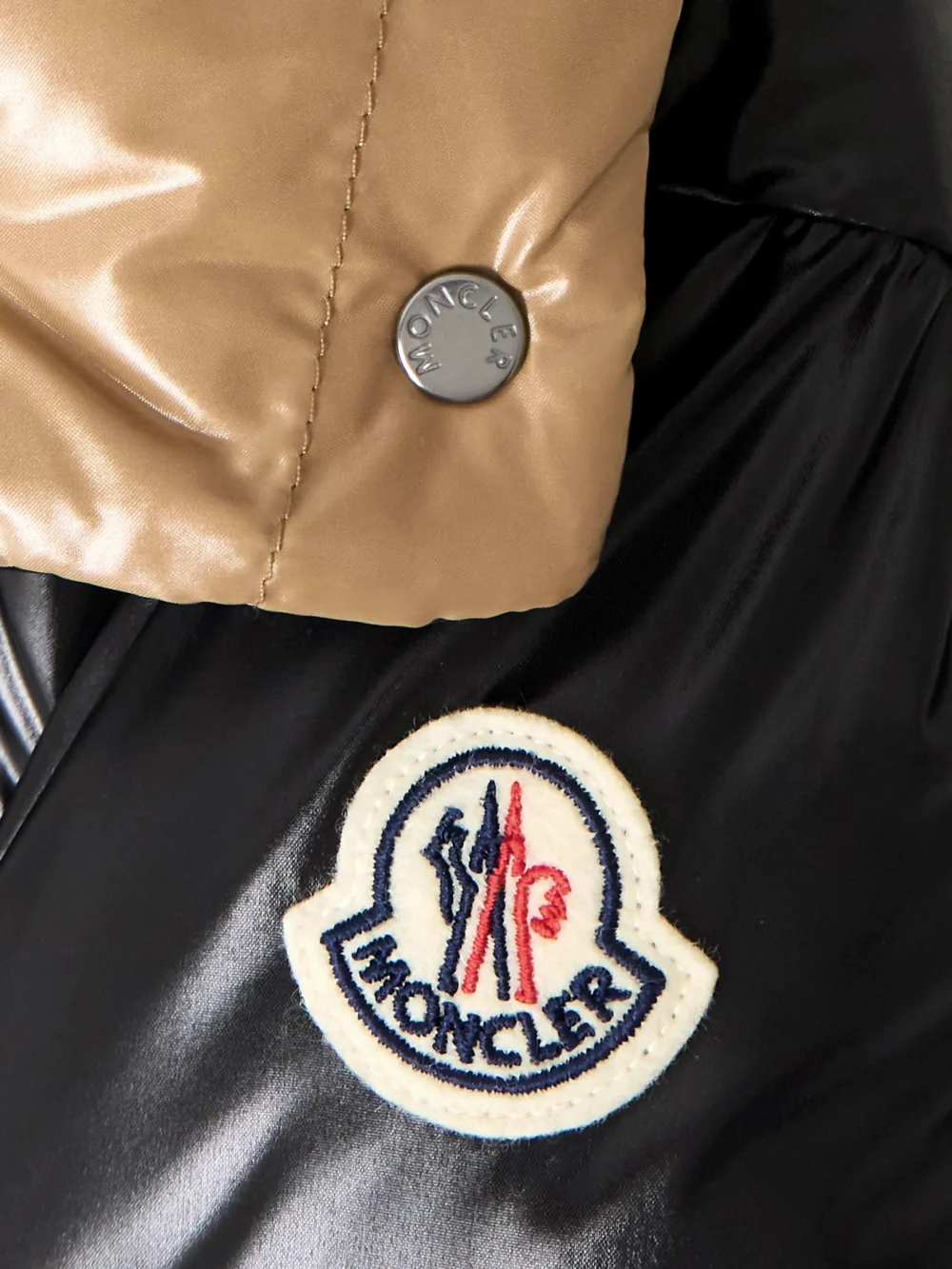 Close-up detail of the Moncler Parana Logo-appliquéd Quilted Shell Hooded Down Jacket