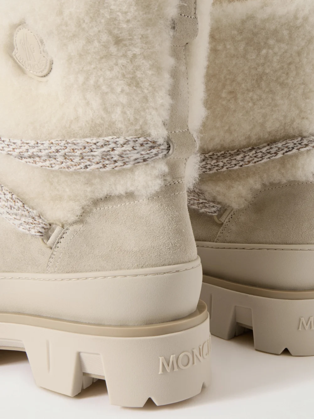 Close-up detail of the Moncler Peak Apres Shearling-trimmed Suede Ankle Boots