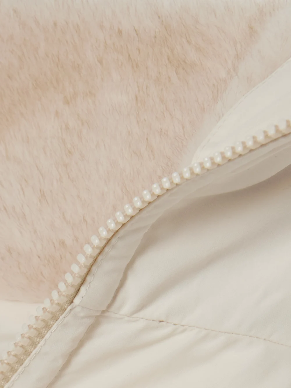 Close-up detail of the Moncler Pervenche Convertible Plush-trimmed Shell Down Jacket