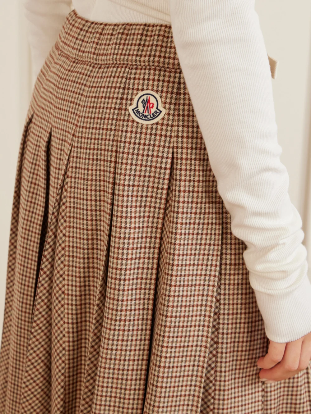 Close-up detail of the Moncler Pleated Checked Wool-blend Midi Skirt