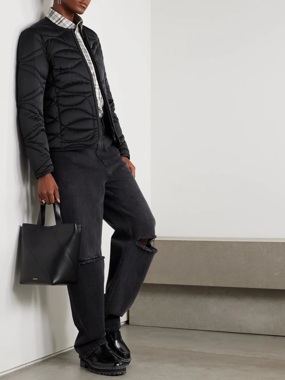 Moncler Pyrope Appliquéd Quilted Shell Down Jacket, worn by a model