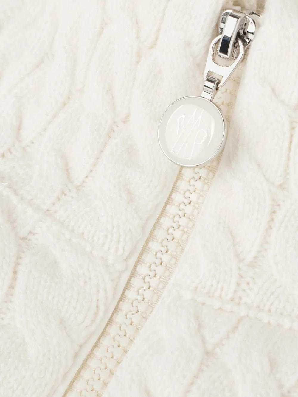 Close-up detail of the Moncler Quilted Padded Cable-knit Cotton-blend Down Jacket