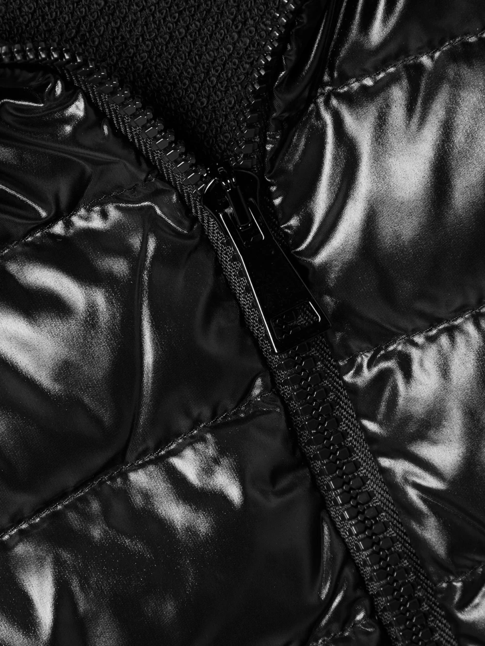 Close-up detail of the Moncler Quilted Shell and Cotton-blend Jersey Down Hooded Jacket