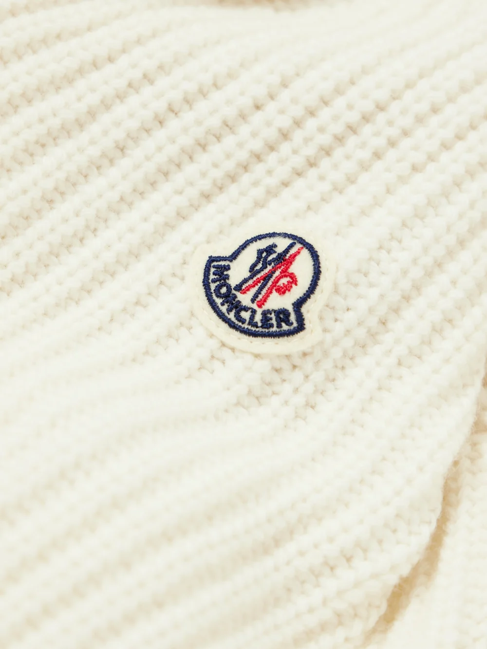 Close-up detail of the Moncler Ribbed Wool and Quilted Shell Down Hoodie