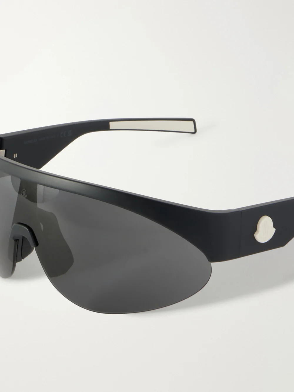 Close-up detail of the Moncler Round-frame Rubber Sunglasses