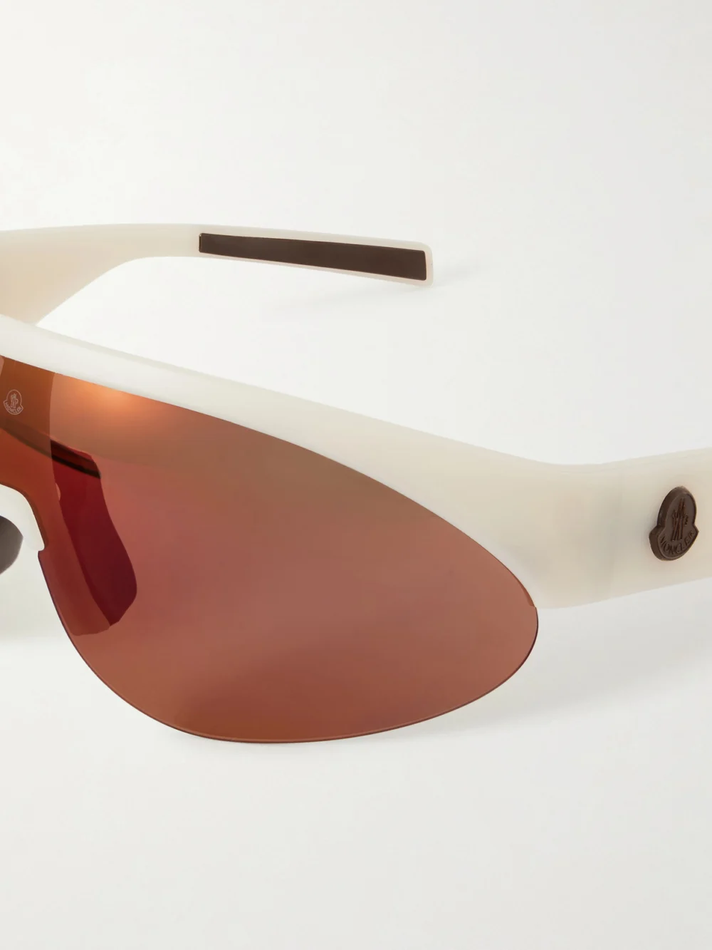 Close-up detail of the Moncler Round-frame Rubber Sunglasses