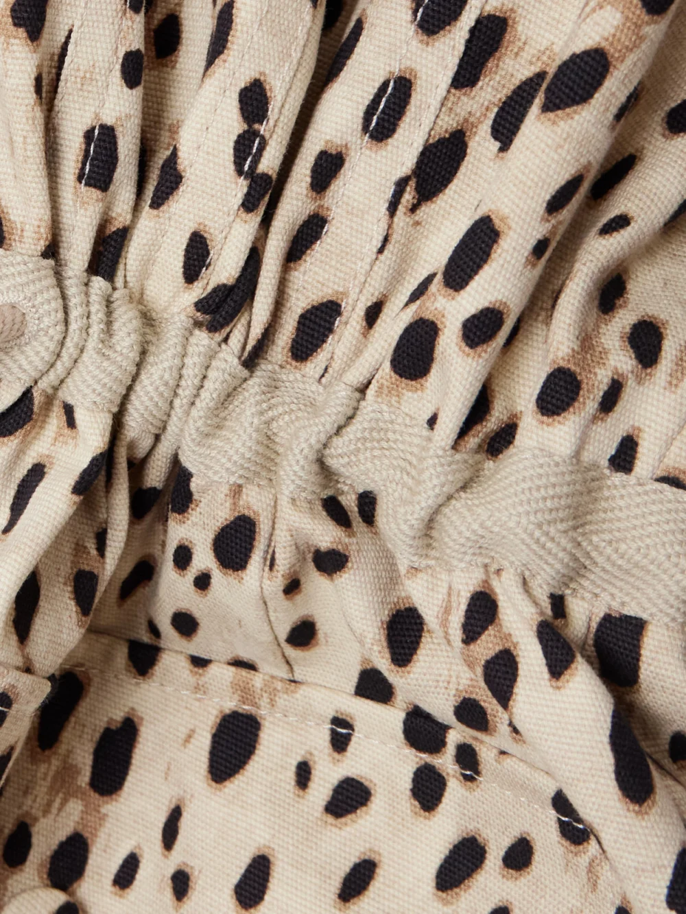 Close-up detail of the Moncler Saulon Appliquéd Animal-print Cotton-blend Canvas Jacket