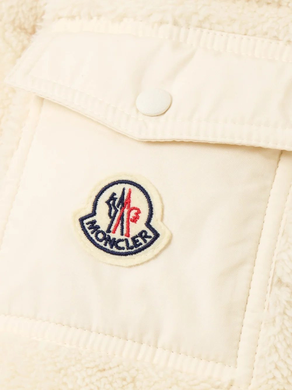 Close-up detail of the Moncler Shell-trimmed Quilted Cotton-fleece Down Jacket