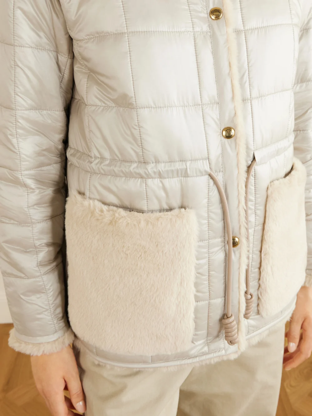 Close-up detail of the Moncler Tipule Plush and Leather-trimmed Shell Jacket