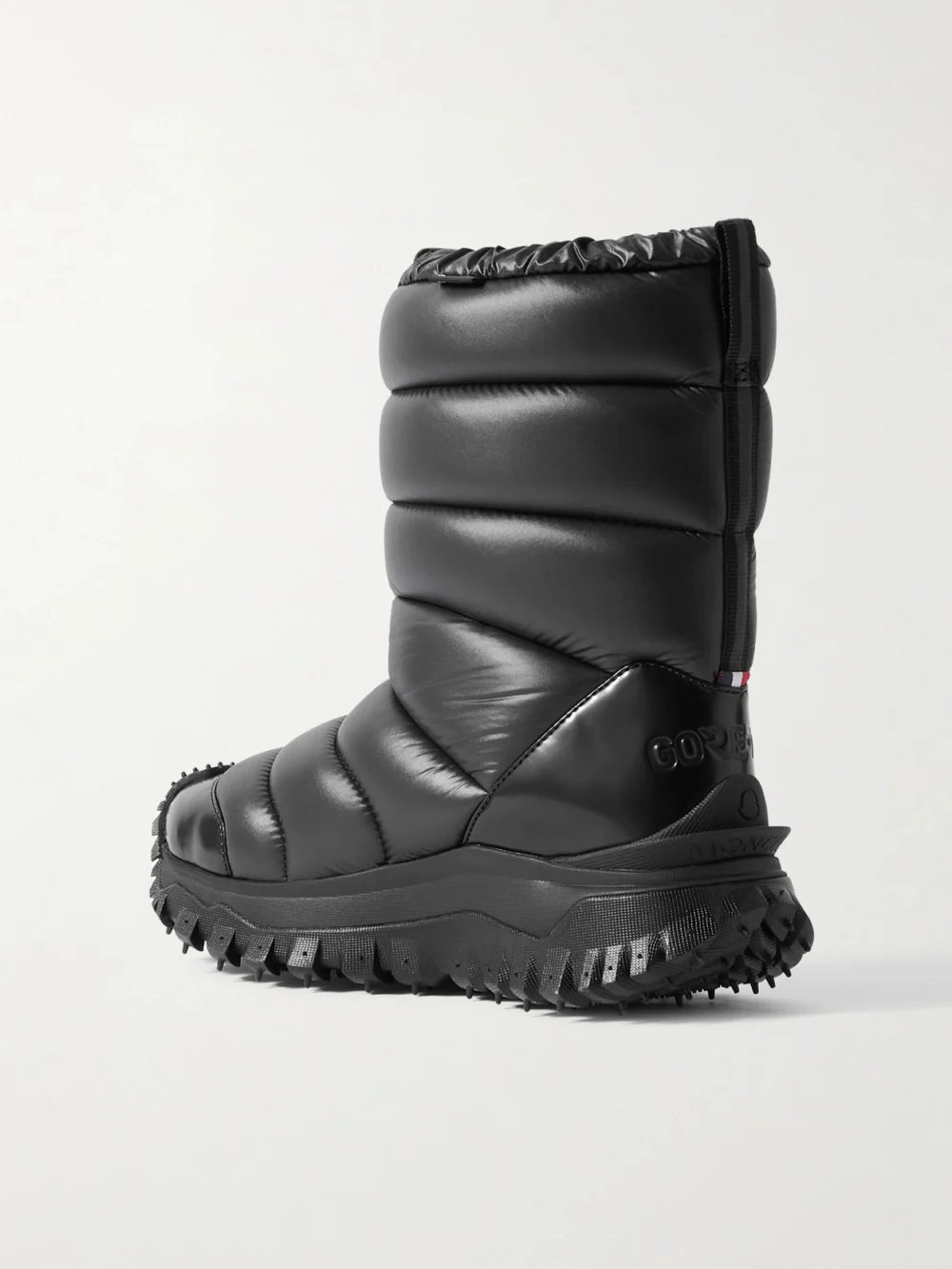 Back view of the Moncler Trailgrip Appliquéd Quilted Padded Glossed Leather-trimmed Shell Snow Boots
