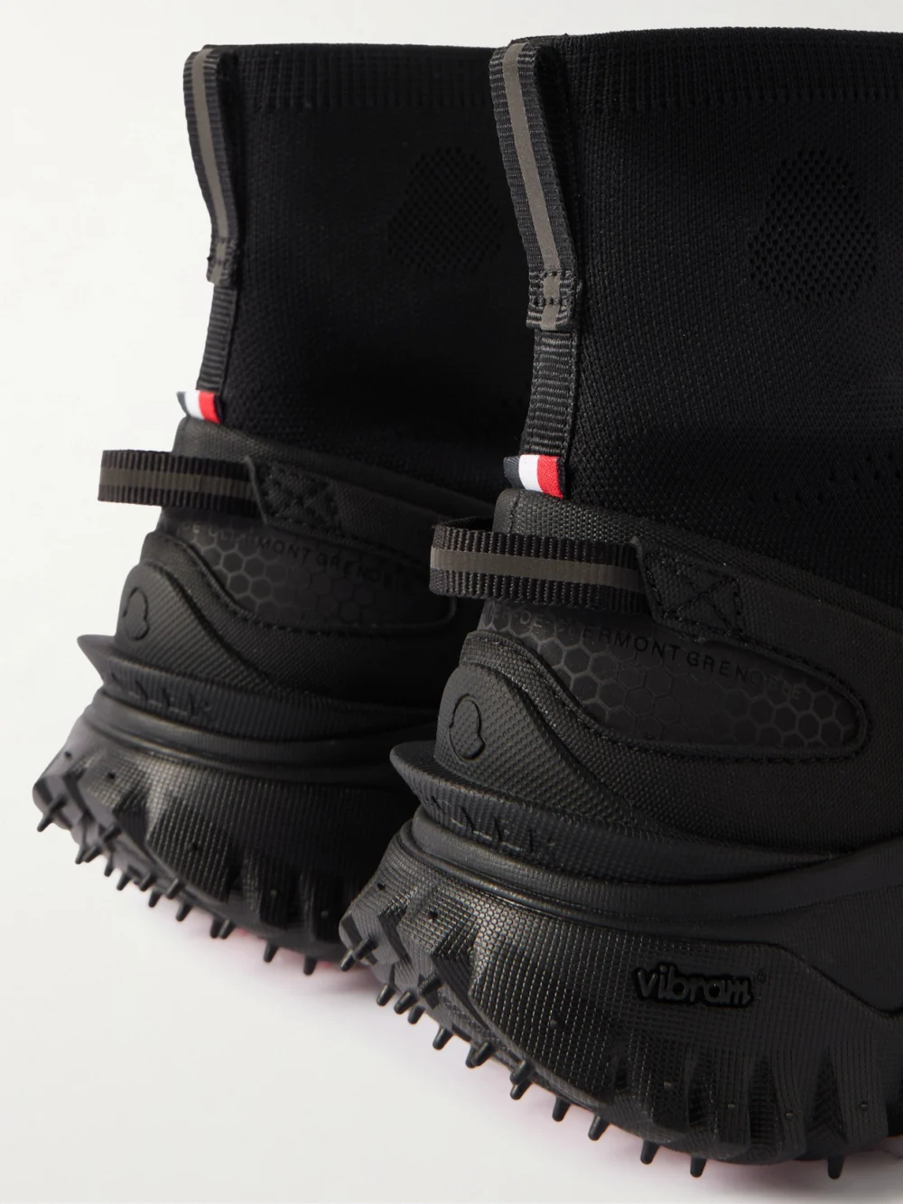Close-up detail of the Moncler Trailgrip Rubber-trimmed Stretch-knit Sneakers