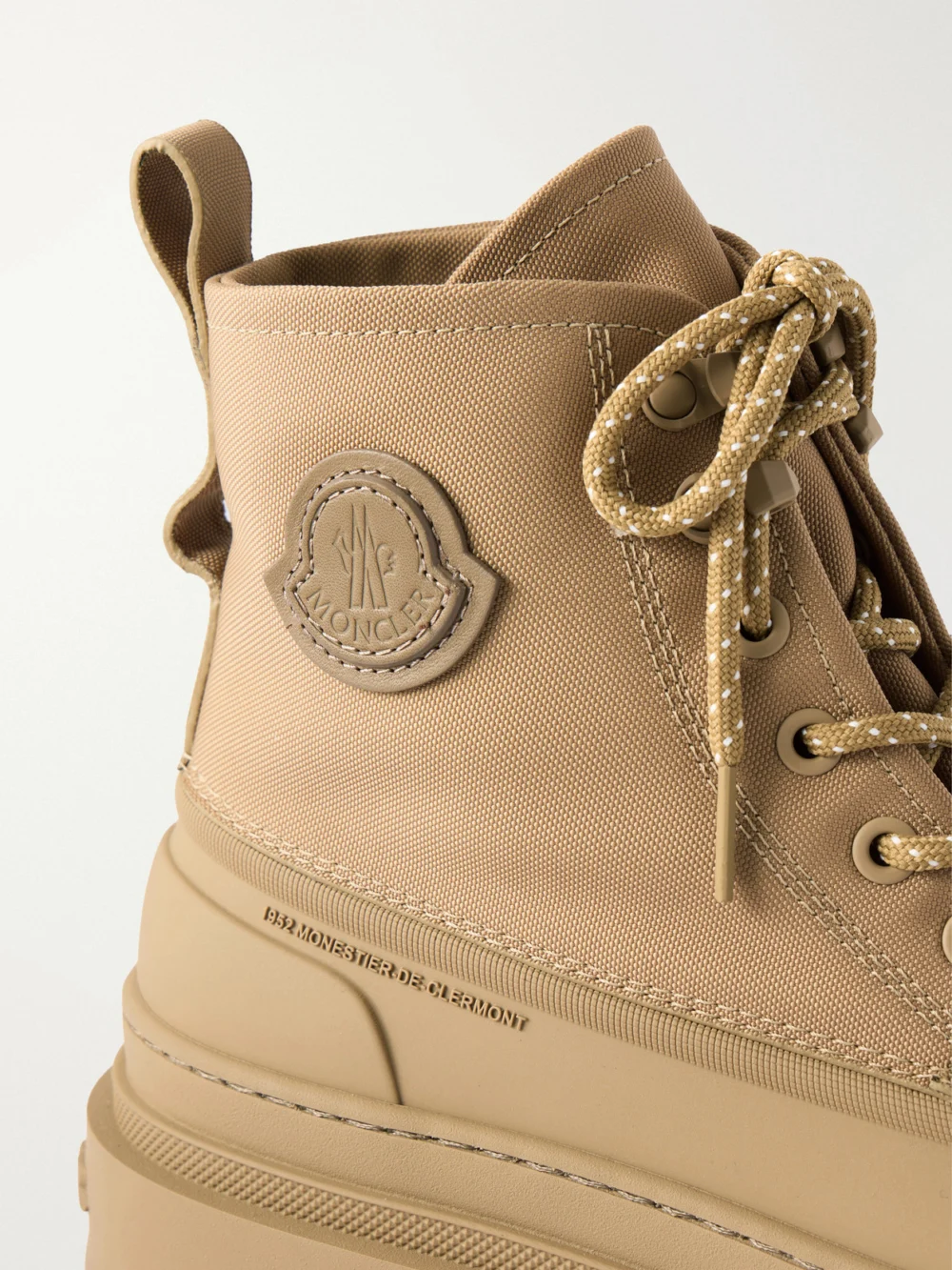 Close-up detail of the Moncler Vera Sheal Rubber-trimmed Canvas Ankle Boots