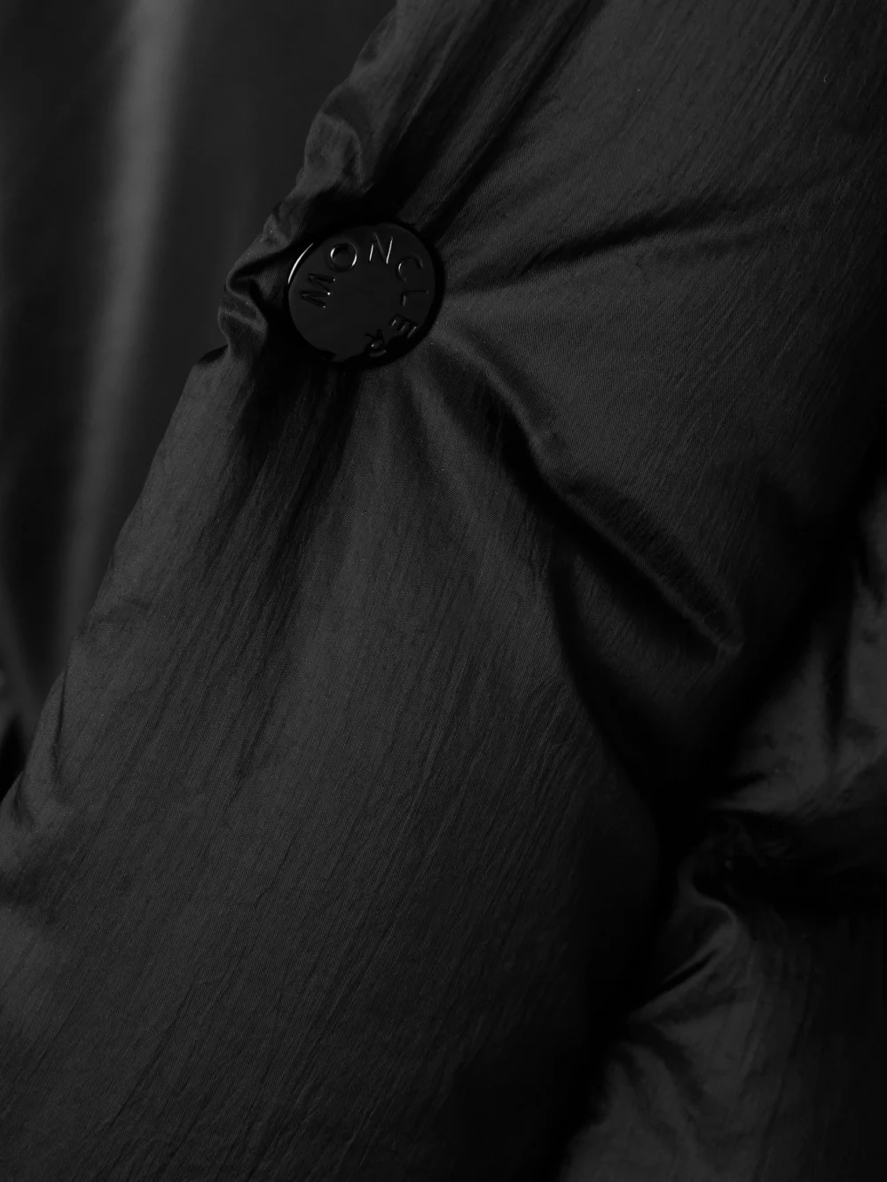 Close-up detail of the Moncler Verone Convertible Hooded Quilted Shell Down Coat