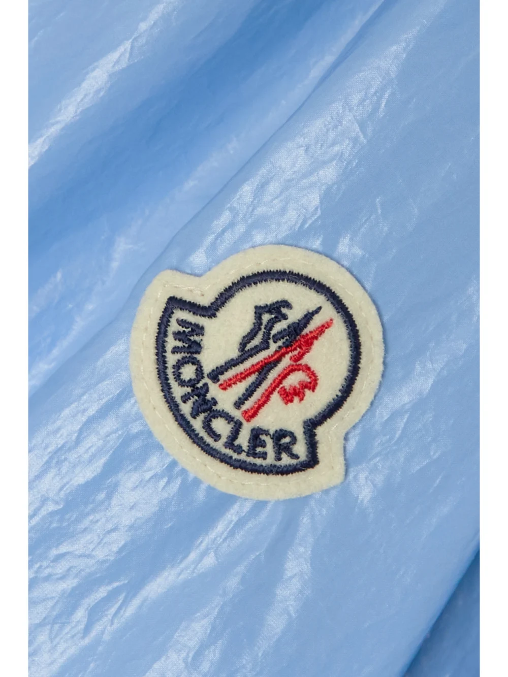 Close-up detail of the Moncler Wuisse Hooded Coated Cotton-blend Jacket