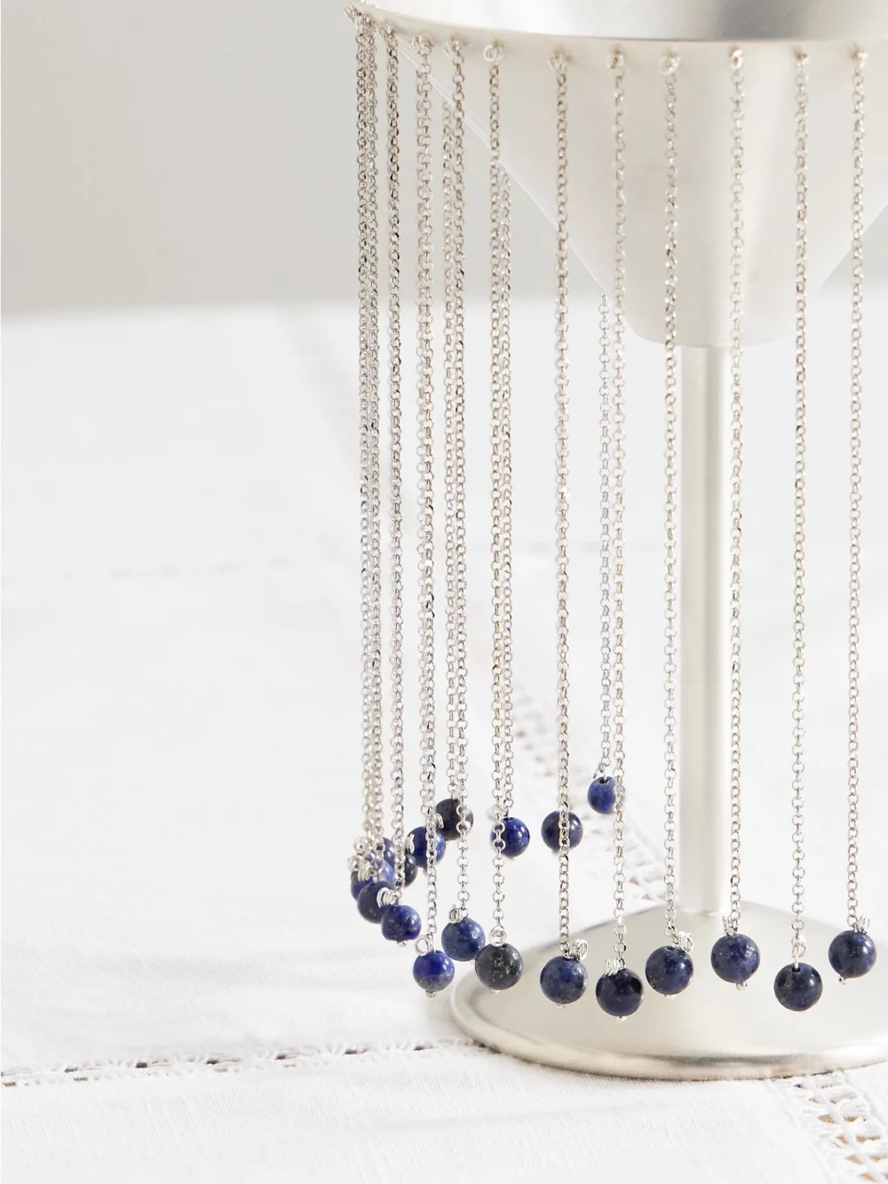 Close-up detail of the Natalia Criado + Taller Marmo Celebration Fringed Silver-plated and Lapis Lazuli Margarita Glass