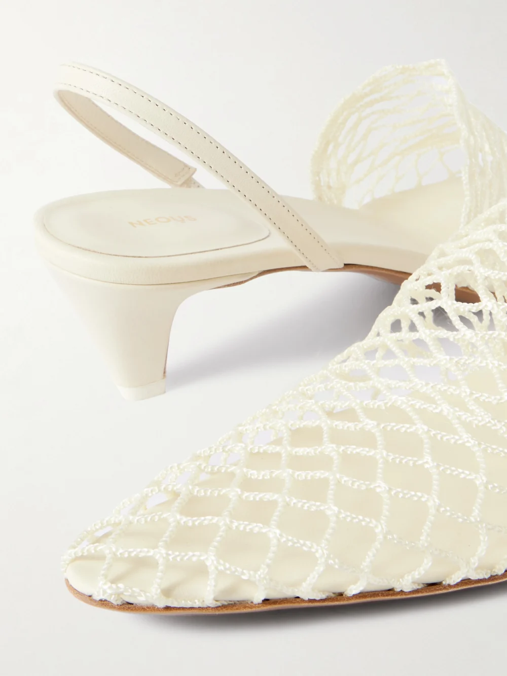 Close-up detail of the Neous Acantho Fishnet and Leather Slingback Pumps