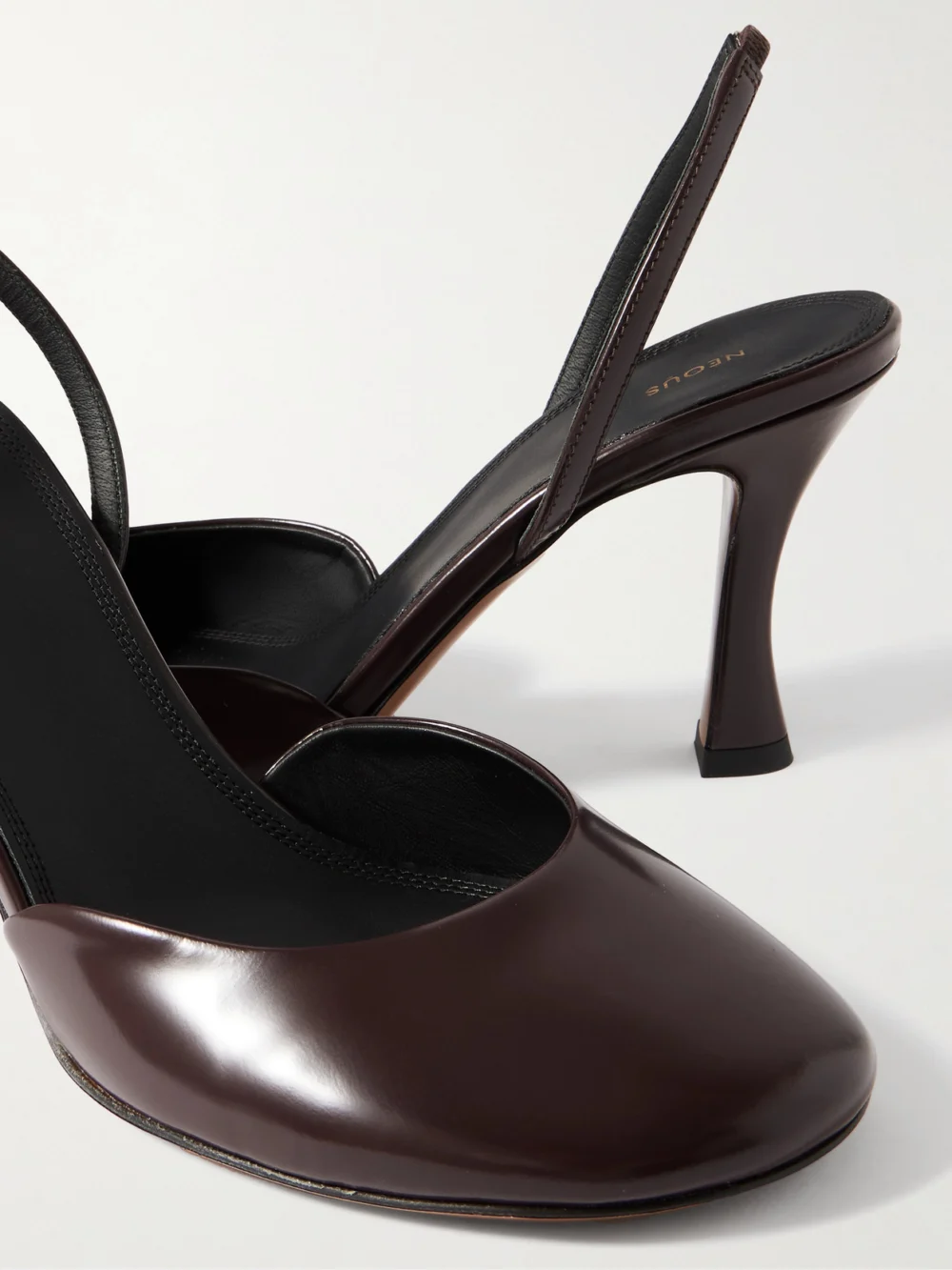 Close-up detail of the Neous Baten Glossed-leather Slingback Pumps