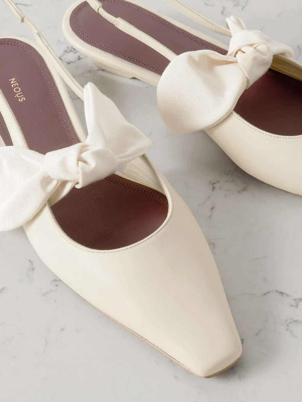 Close-up detail of the Neous Uba Bow-embellished Faille and Leather Slingback Flats
