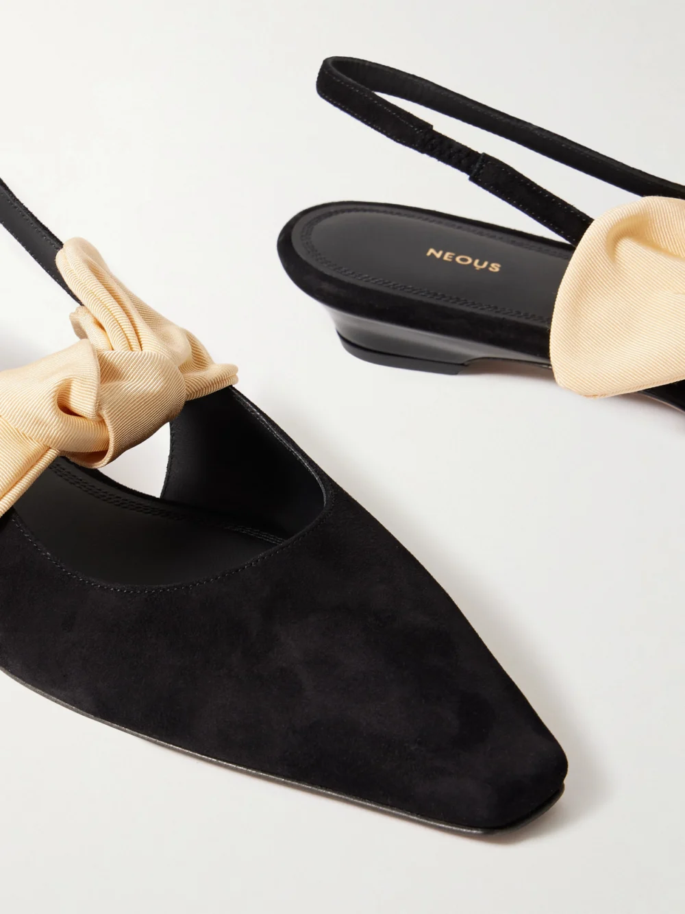 Close-up detail of the Neous Uba Bow-embellished Faille and Suede Slingback Flats
