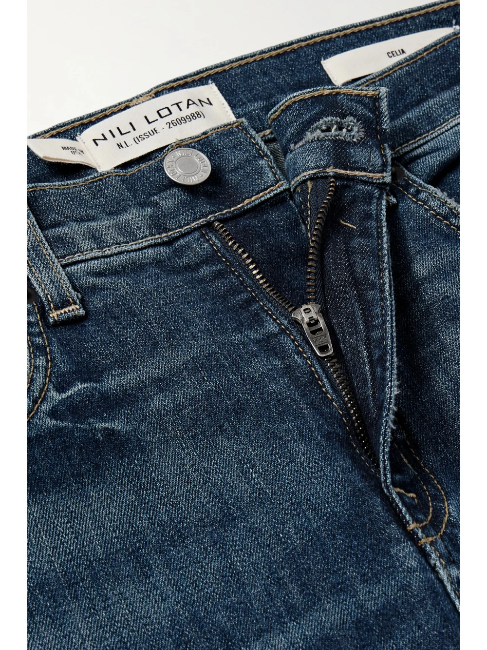Close-up detail of the Nili Lotan Celia High-rise Flared Jeans