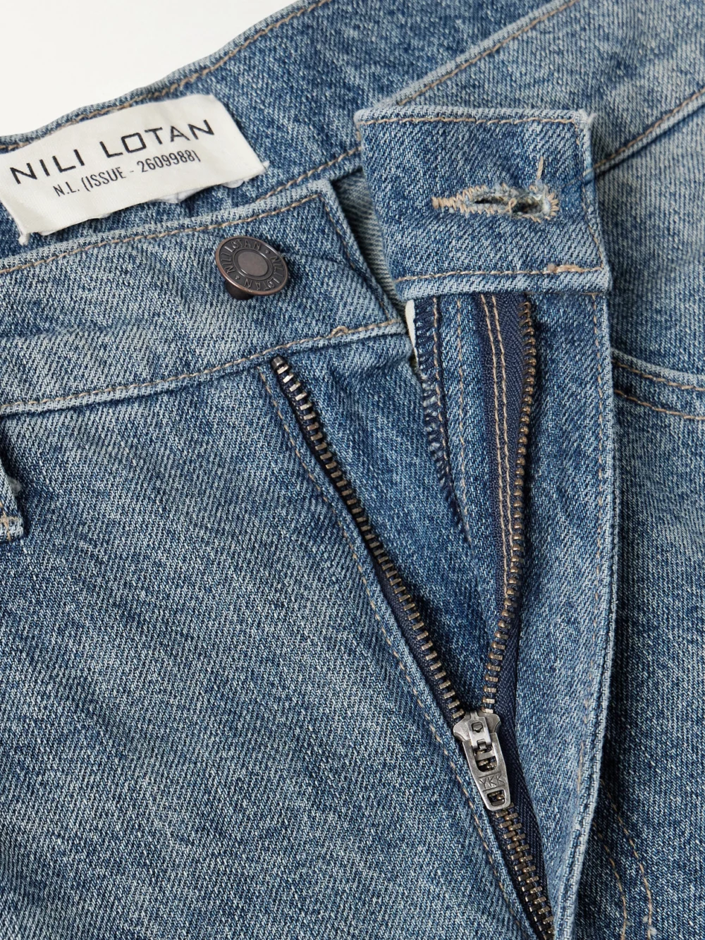Close-up detail of the Nili Lotan Ebony Paneled Two-tone High-rise Wide-leg Jeans
