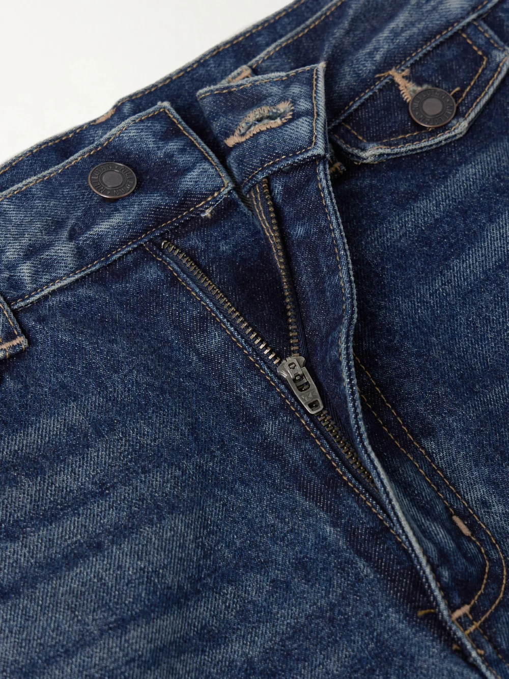 Close-up detail of the Nili Lotan Edira High-rise Flared Jeans