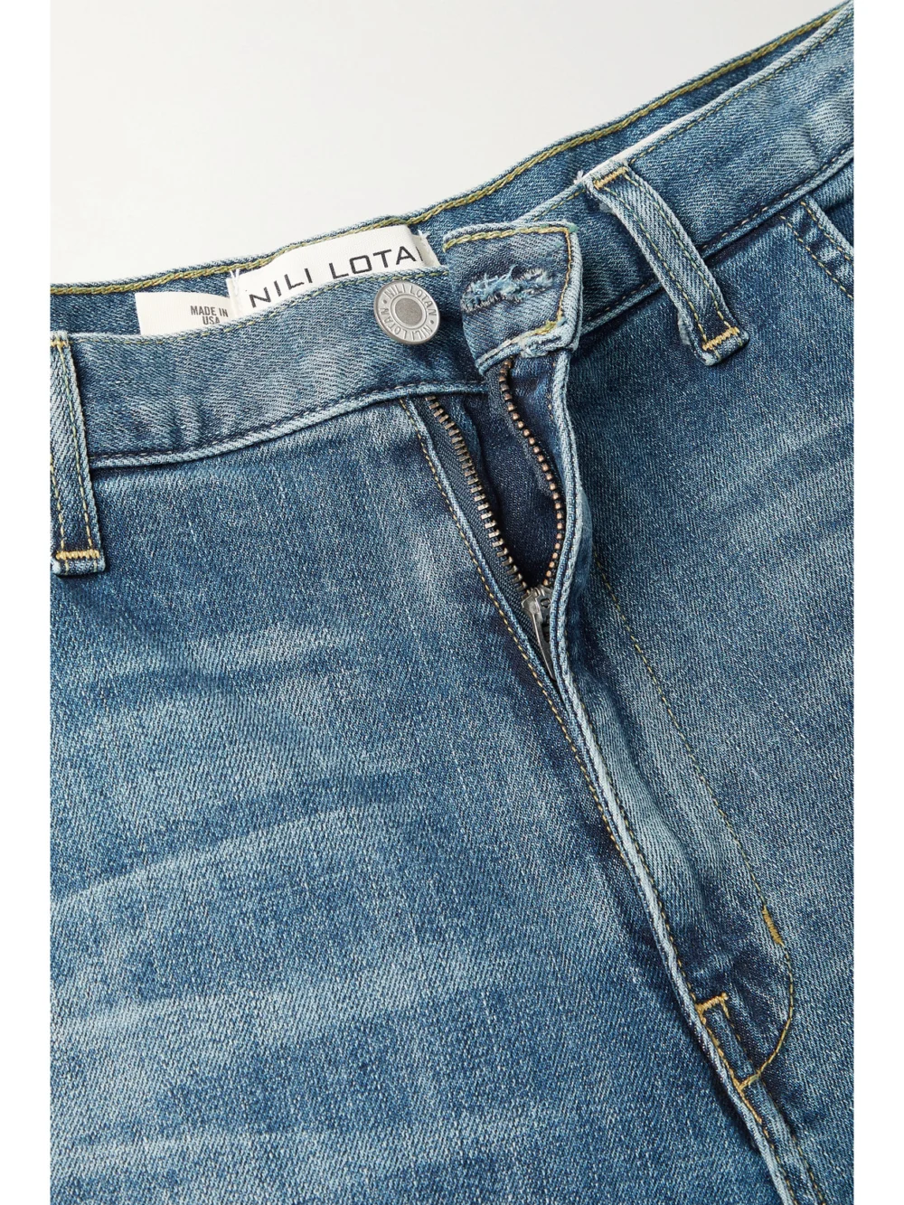 Close-up detail of the Nili Lotan Emerson High-rise Tapered Jeans