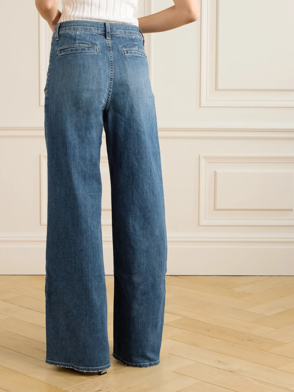 Back view of the Nili Lotan Flora Pleated High-rise Wide-leg Jeans
