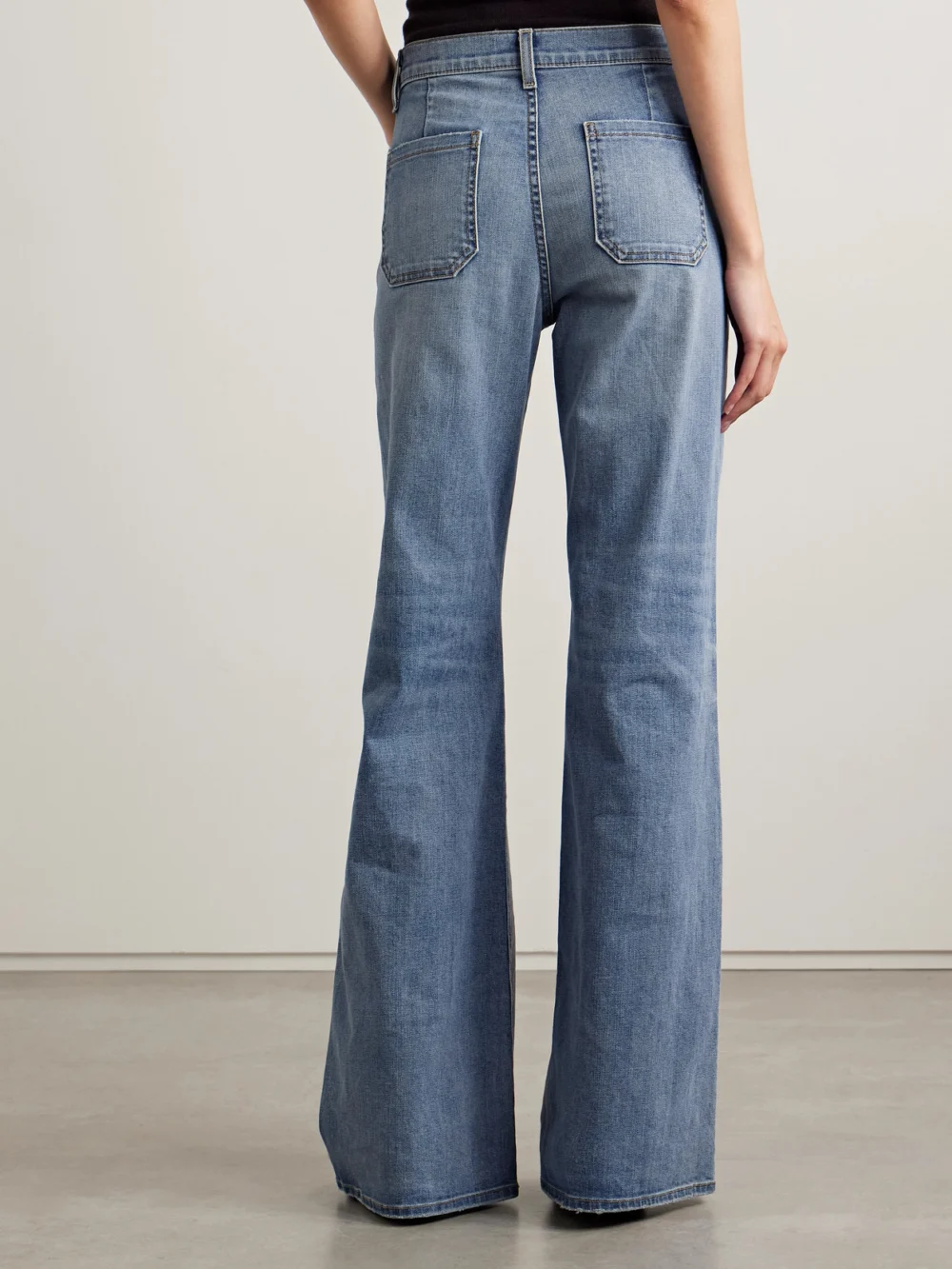 Back view of the Nili Lotan Florence Distressed High-rise Flared Jeans